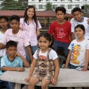 Mikee with the students in year 6 after a lunch at a waterfront restaurant