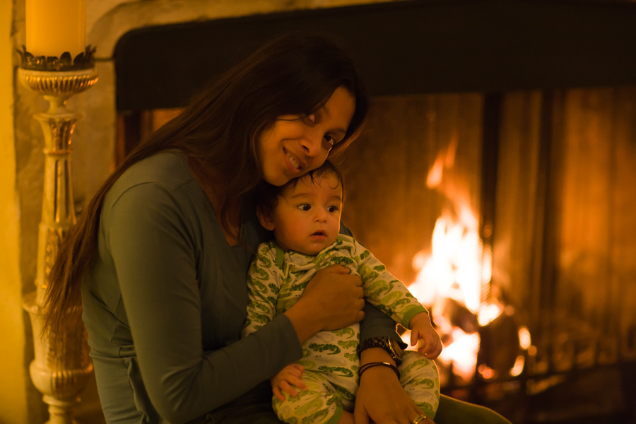 At the fireplace. Eric five months old. 2008