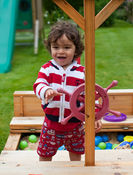 Eric at the wheel of the play boat in our garden