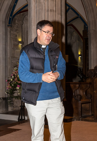 Tim Treanor, the local vicar, explaining the wedding ceremony the day before