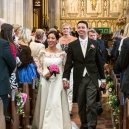 The bride and groom walking out as  husband and wife