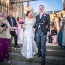 Confetti being trown at the couple on the church steps