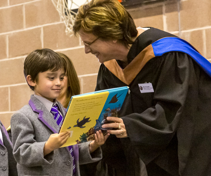 Eric receiving a prize from Mrs Colwill, head of Junior School