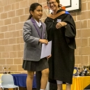 Mikee receiving her prize from Mrs Colwill