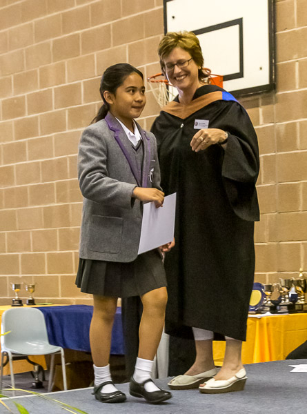 Mikee receiving her prize from Mrs Colwill