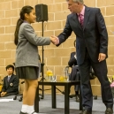 Mikee shaking hands with the headmaster, Mr Larter