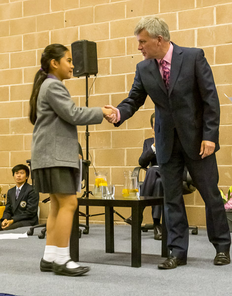 Mikee shaking hands with the headmaster, Mr Larter