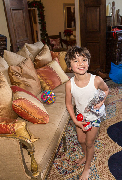 Eric playing with his Christmas stocking gifts in the early morning