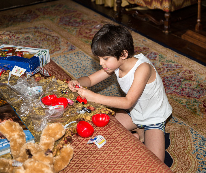 Eric playing with his Christmas stocking gifts in the early morn