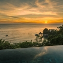 Sunset over the sea with our infinity pool in the foreground