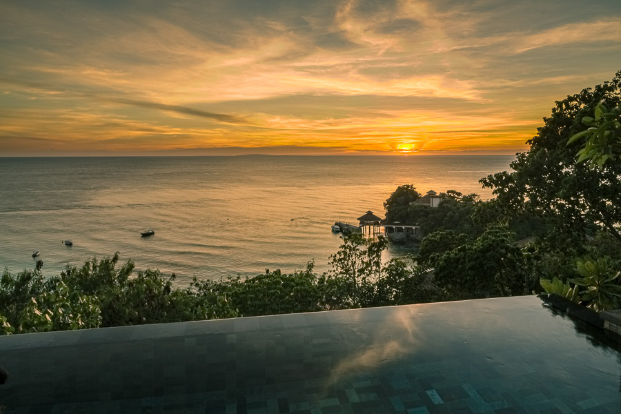 Sunset over the sea with our infinity pool in the foreground